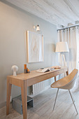 Modern console table against light grey wall
