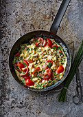 Scrambled eggs with tomatoes and chives