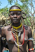 Young Mursi tribeswoman with beauty scarring