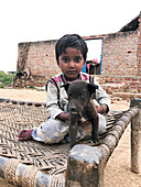 Boy holding a puppy