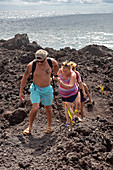 Hikers on lava flow from Kilauea volcano eruption