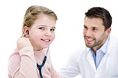Girl role playing doctor with stethoscope