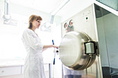 Technician working autoclave