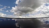 Clouds moving above water