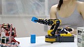 Woman controlling robot