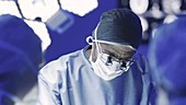 Surgeon wearing magnifying glasses