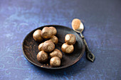 Truffle pralines rolled in gold powder