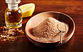 Homemade cinnamon sugar in a wooden bowl and rum sugar in a small apothecary bottle