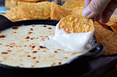 Corn crisps with a goat's cheese cheddar dip