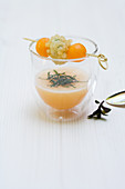 Iced melon soup with baked shrimp and melon balls