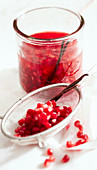 Homemade pomegranate essence in a jar with vanilla and balsamic vinegar Bianco