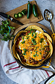 Spicy Mexican eggs with tortillas in a pan