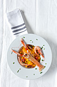 Homemade rice with crayfish and prawns on white background