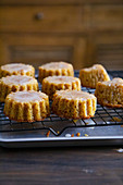 Orange and almond cakes on a cooling rack