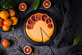 Blood orange cheesecake on a dark background