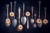 Biscuits with marmalede filling on vintage spoons