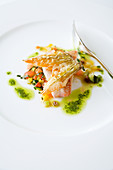 Red mullet on ratatouille vegetables with basil oil
