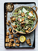 Caesar salad with brussels sprouts and croutons