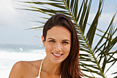 A brunette woman by the sea