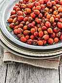 Fresh rosehips on a metal plate