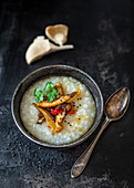 Congee with oyster mushrooms, chicken, chili and fish sauce
