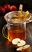 Homemade baked apple liqueur with vanilla, anise, cinnamon and corn schnapps