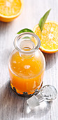Homemade orange syrup with fresh fruits