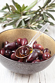 Black kalamata olives in small bowls