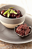Tapenade and black olives in small bowls