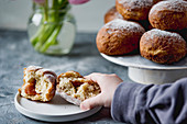 Donuts with jam and powdered sugar