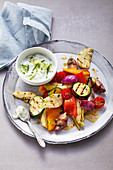 Colourful grilled vegetables with tzatziki