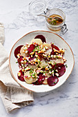 Beetroot carpaccio with Harz cheese with apples and walnuts