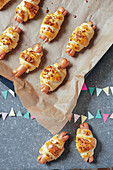Mini hot dogs in croissant pastry