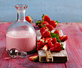 Homemade strawberry cream liqueur with fresh berries and vodka