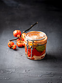 Pickled chilli peppers in a flip-top jar