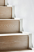 Detail of modern wooden staircase in sunshine