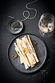 Black salsify cooked in parchment paper with orange zest