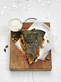 Persian rice cake with vine leaves and pistachios (Christmas)