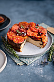 Cheesecake with blood oranges and rosemary, sliced
