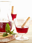 Homemade cranberry liqueur with mint, cinnamon and vodka