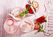 Homemade strawberry cream liqueur with fresh berries, vanilla, cream, sugar and vodka