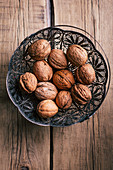 Ornamental basket with walnuts