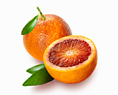 Blood orange whole and halved with leaves