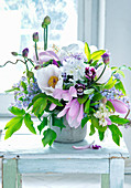 Bouquet of magnolia, peonies, lilac and alliums