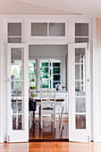 View through open double doors into the dining room of a renovated Queenslander