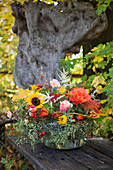 Autumn bouquet in glass bowl