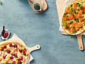 Two pizzas: with apple and cranberries, and with salmon