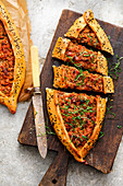 Turkish pide with lamb and black cumin