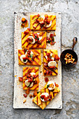 Grilled polenta with dried tomatoes and pine nuts
