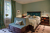 Classic, English-style bedroom with green walls